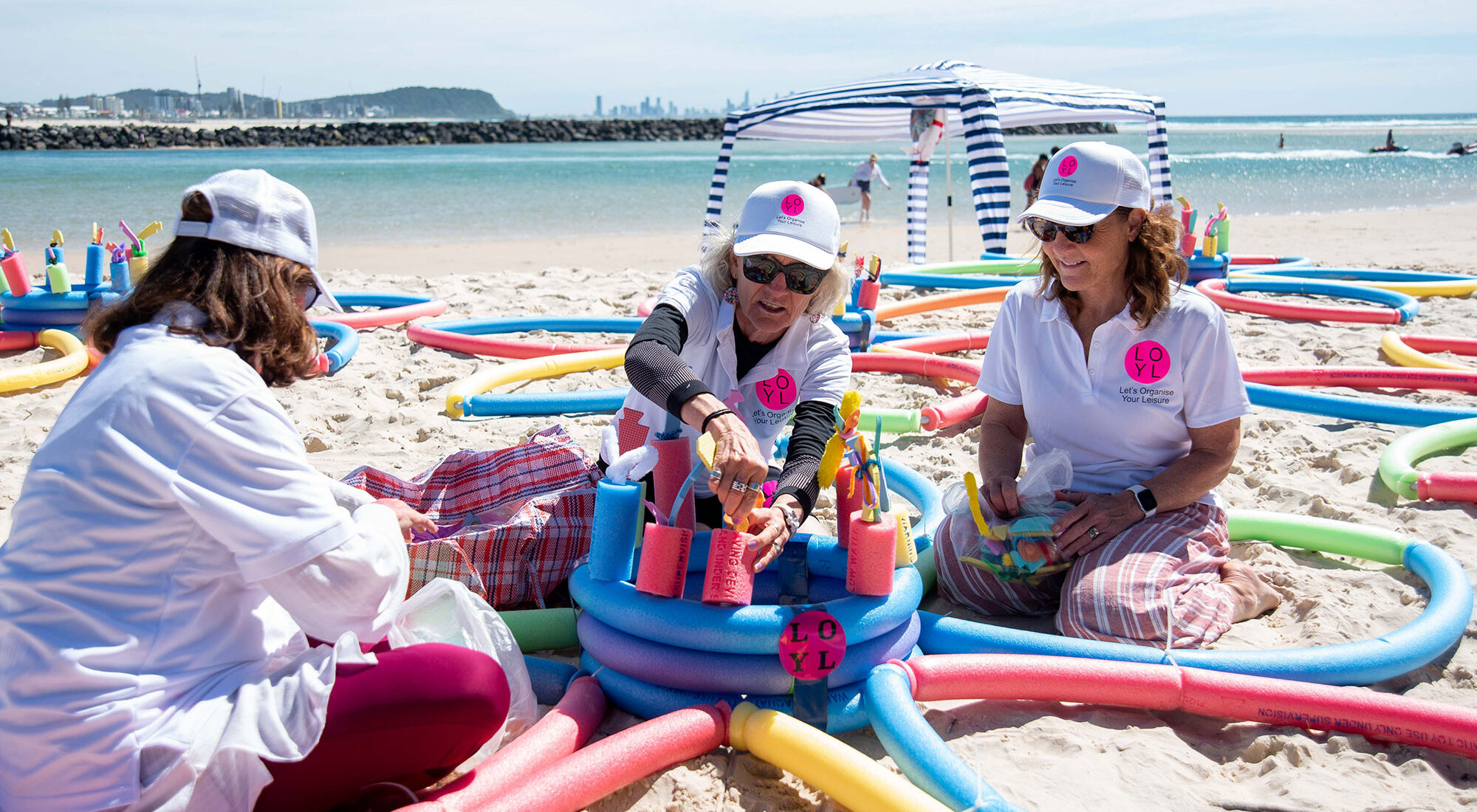 People making flotation devices using pool toys